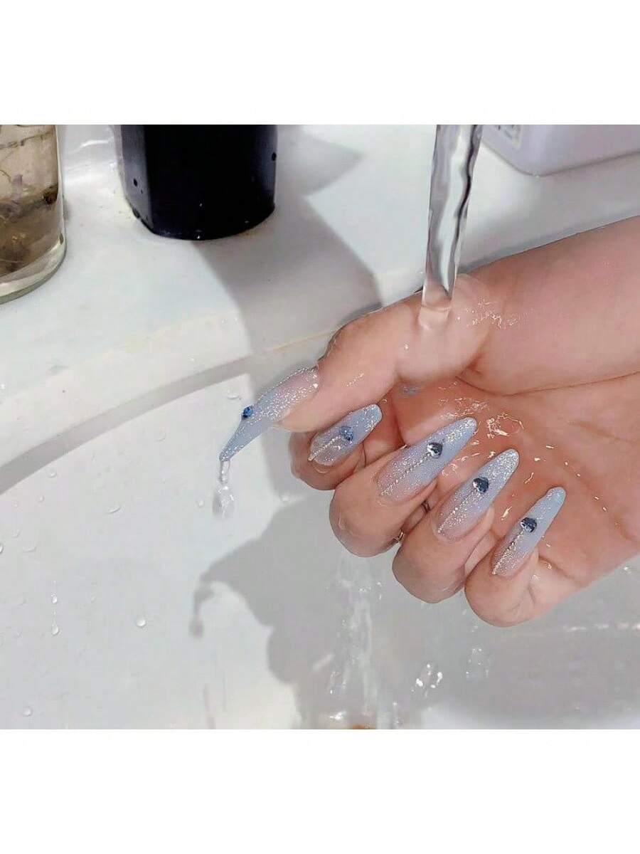 Long Stiletto Press-On Nails With Heart-Shaped Rhinestones, Blue Gradient Tips, Glitter Decorations, And Glossy Finish. This High-Quality Acrylic Nail Set Is Designed For Various Occasions To Add A Touch Of Elegance And Unique Charm To Your Nails.