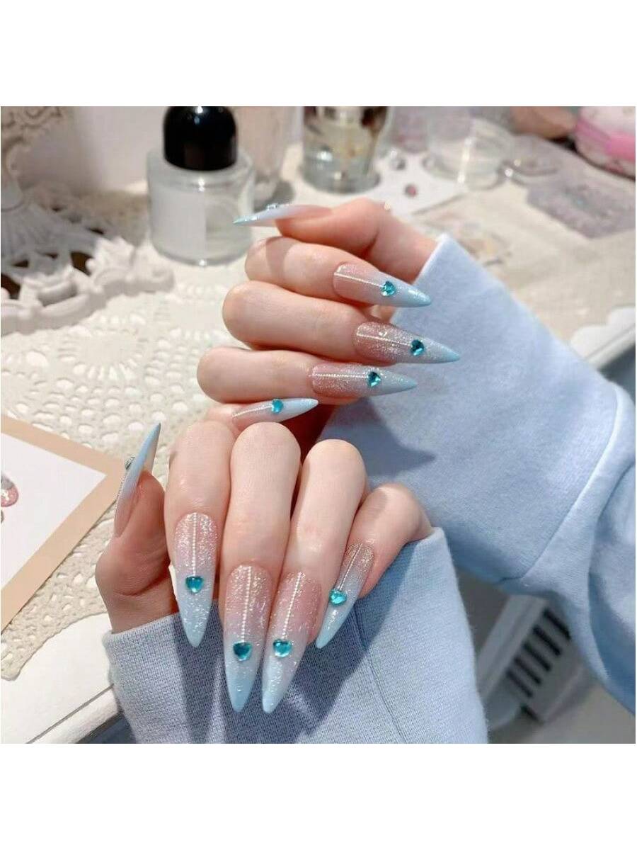 Long Stiletto Press-On Nails With Heart-Shaped Rhinestones, Blue Gradient Tips, Glitter Decorations, And Glossy Finish. This High-Quality Acrylic Nail Set Is Designed For Various Occasions To Add A Touch Of Elegance And Unique Charm To Your Nails.