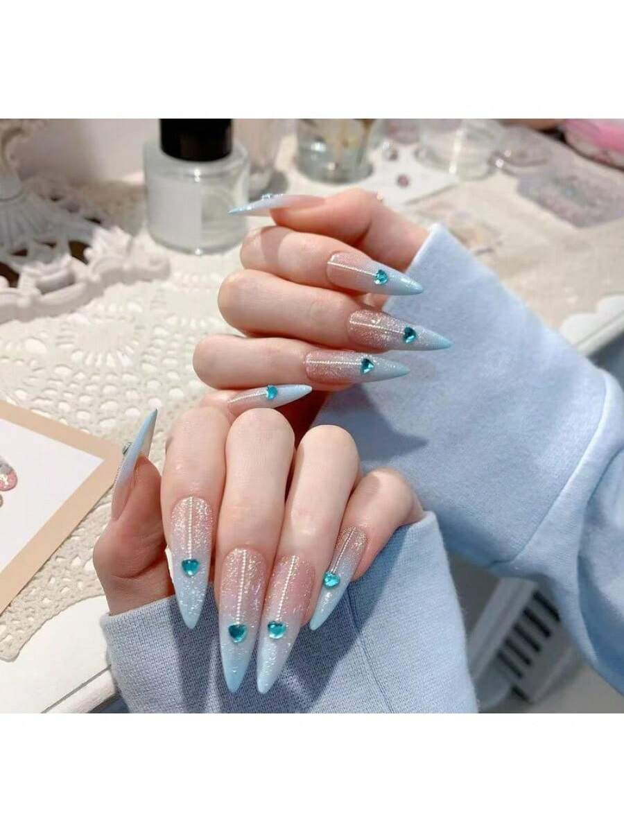 Long Stiletto Press-On Nails With Heart-Shaped Rhinestones, Blue Gradient Tips, Glitter Decorations, And Glossy Finish. This High-Quality Acrylic Nail Set Is Designed For Various Occasions To Add A Touch Of Elegance And Unique Charm To Your Nails.