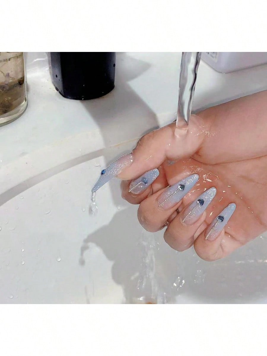 Long Stiletto Press-On Nails With Heart-Shaped Rhinestones, Blue Gradient Tips, Glitter Decorations, And Glossy Finish. This High-Quality Acrylic Nail Set Is Designed For Various Occasions To Add A Touch Of Elegance And Unique Charm To Your Nails.