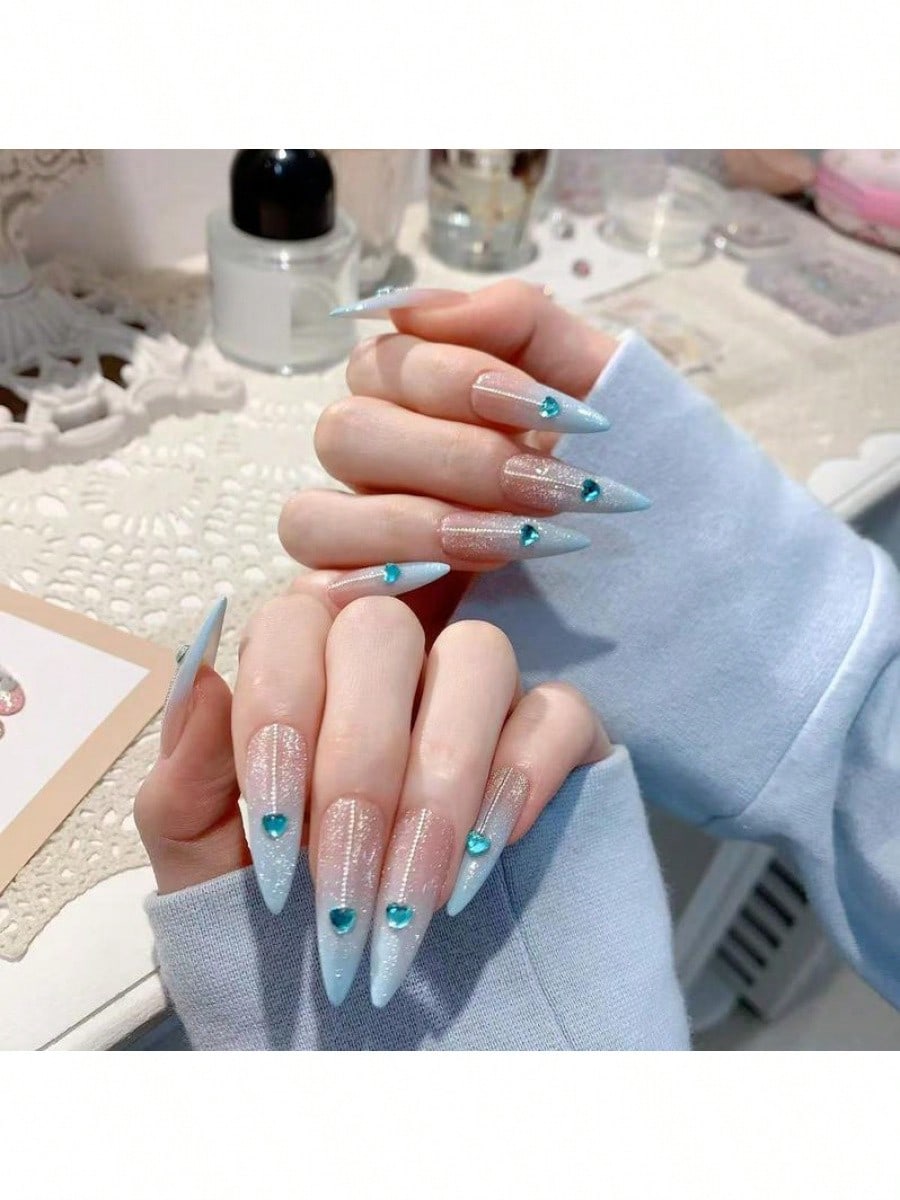 Long Stiletto Press-On Nails With Heart-Shaped Rhinestones, Blue Gradient Tips, Glitter Decorations, And Glossy Finish. This High-Quality Acrylic Nail Set Is Designed For Various Occasions To Add A Touch Of Elegance And Unique Charm To Your Nails.