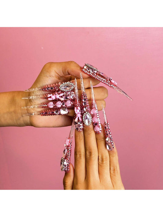 Handmade Press On Nails Medium Long Stiletto Pink And Nude Nail Tips With Heart And Gemstone Embellishments. Delicately Crafted For A Sweet And Glamorous Look. Handcrafted Nail Art For Party Nails, Wedding Nails, Daily Wear Nails, Holiday Nails. Easy To A